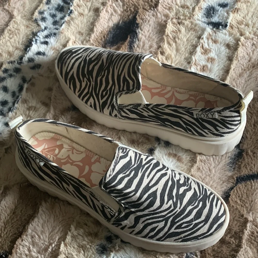 Roxy Zebra Print Platform Slip-On Sneakers in Black and Cream